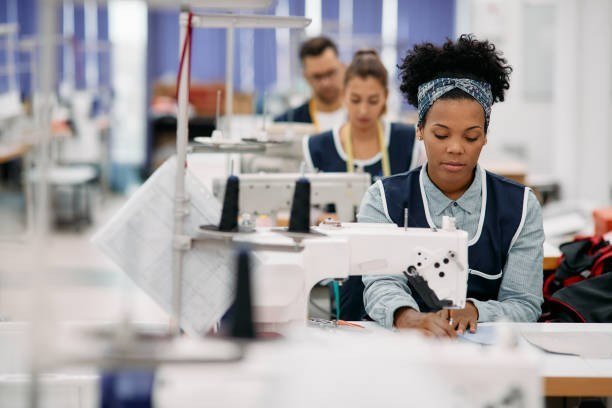 Team member finishing a garment with attention to detail